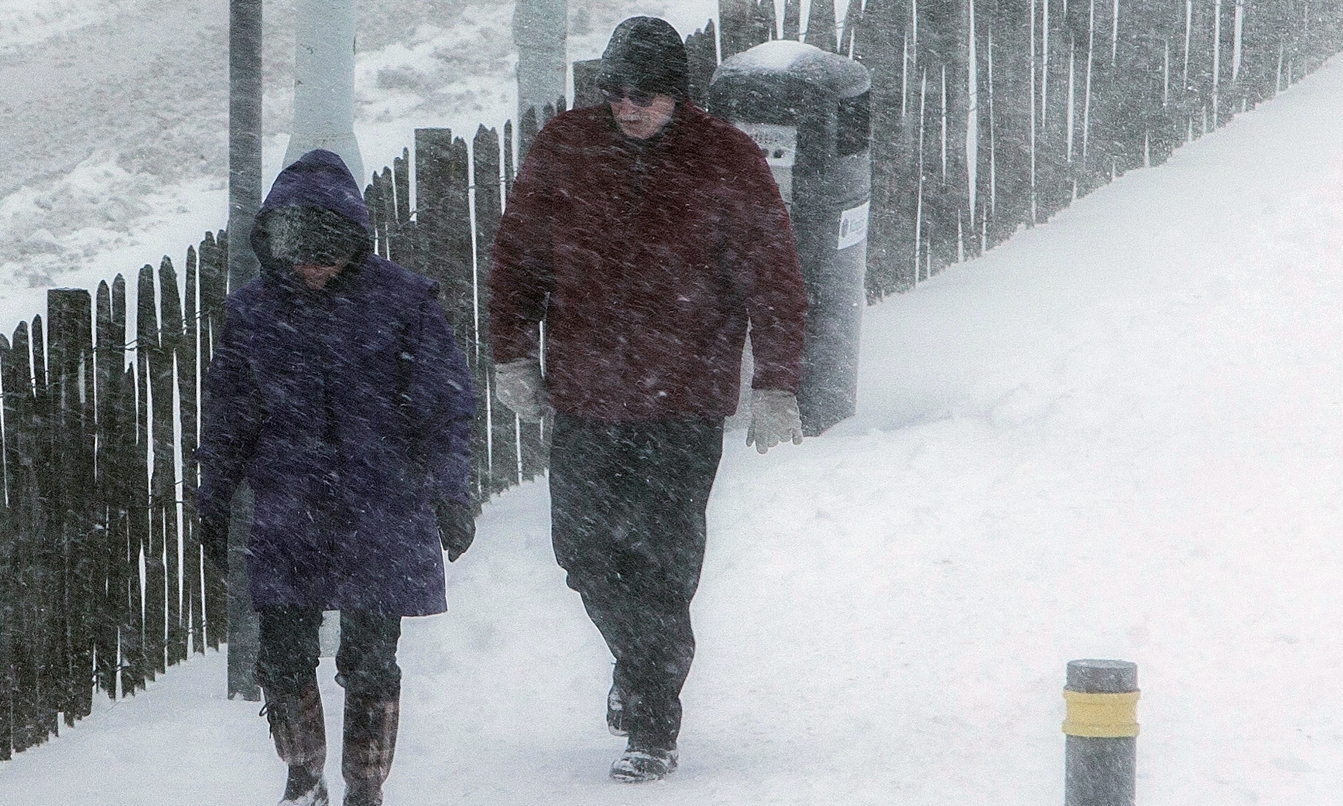 People trudge through the blizzard condition to try to get some necessary shopping in from the Kingdom Centre in Glenrothes.