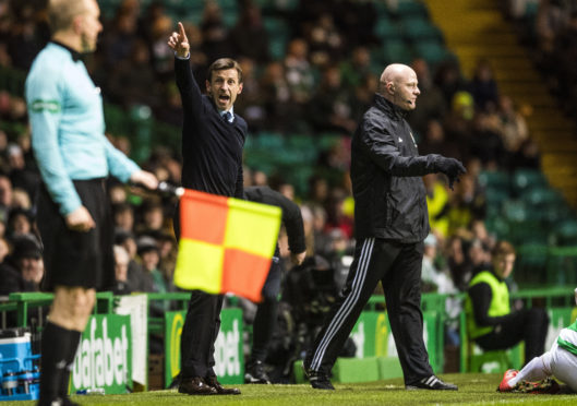 Dundee manager Neil McCann on the touchline at Celtic Park.