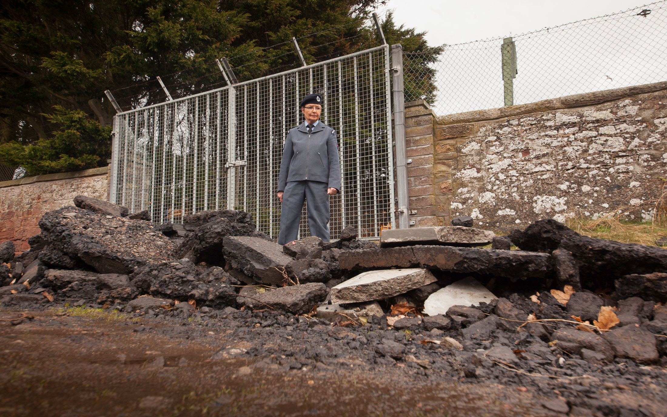 Cheryl Smith views the dumped rubble.