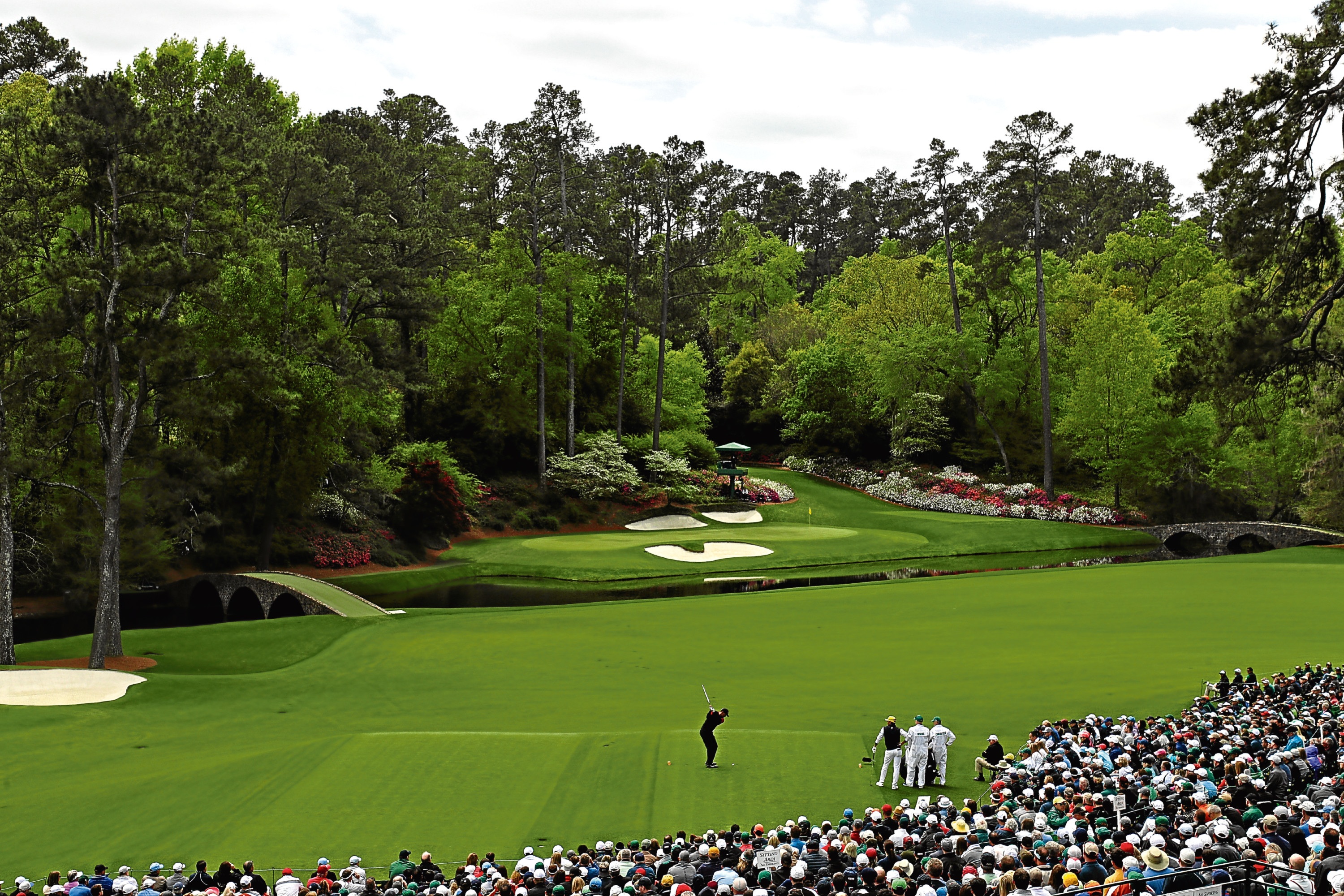 Tiger Woods of the United States plays his first shot from the 12th hole during the final round of the 2018 Masters Tournament at Augusta National Golf Club on April 8.