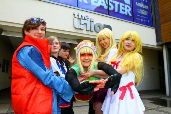 Students gathered as super heroes to promote this year's event, Lia Onest is held aloft by Shaun Dulley,Toni Burns, Keillor Faichney, Rebecca Templeton and Jenny Tu.