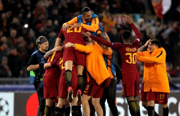 Roma's players celebrate.