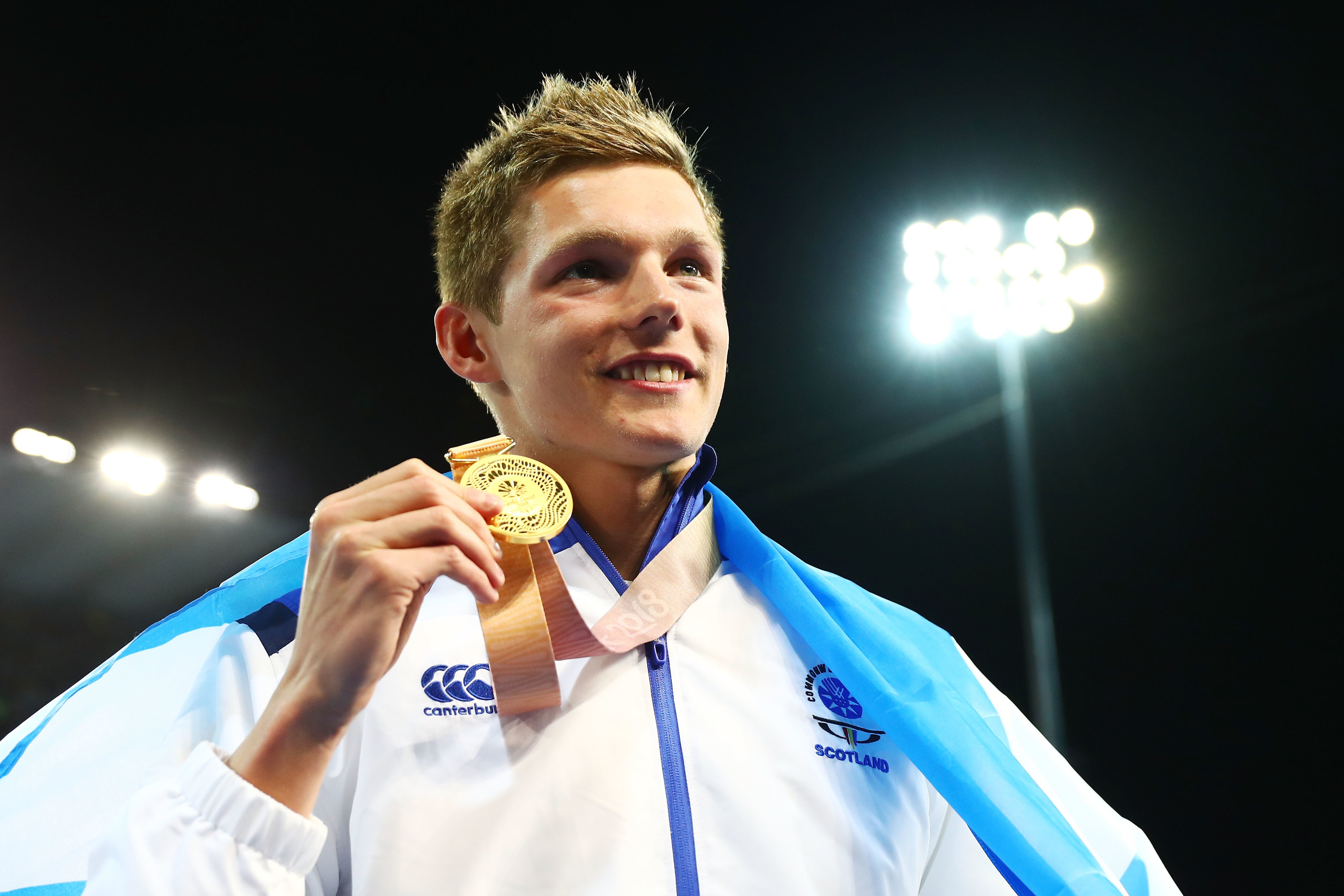 Duncan Scott of Scotland poses during the medal ceremony for the Men's 100m Freestyle Final