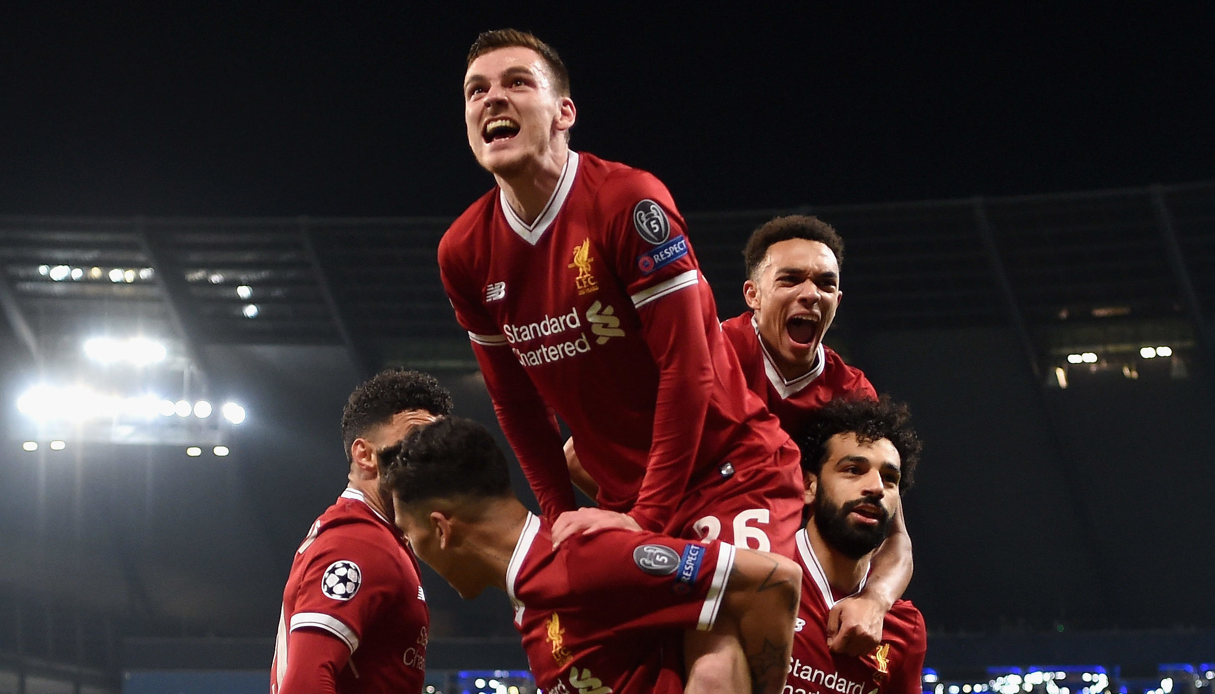 Andy Robertson of Liverpool joins in as the team celebrate their first goal during the UEFA Champions League Quarter Final Second Leg match between Manchester City and Liverpool.