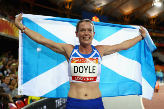Eilidh Doyle celebrates winning silver in the women's 400 metres hurdles final