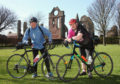 Colin Grant, left, and Ewen Chalmers, right, posing with their bikes in front of Arbroath Abbey.