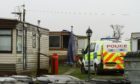 The scene of the fatal fire at Woodley Caravan Park