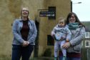Christine Palmer, left, president of Anstruther Improvements Association, with committee member Chloe Milne and her 18-month-old daughter Robin Ritchie Milne.