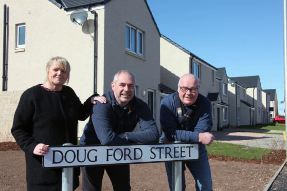 Diane Faulkner, Mark Ford and David Fairweather at the street.