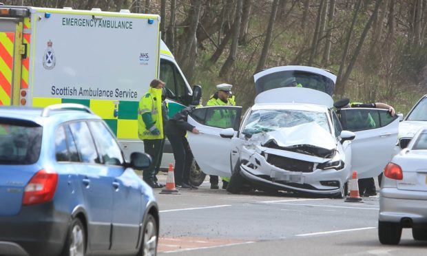 Police and ambulance personnel at the scene.