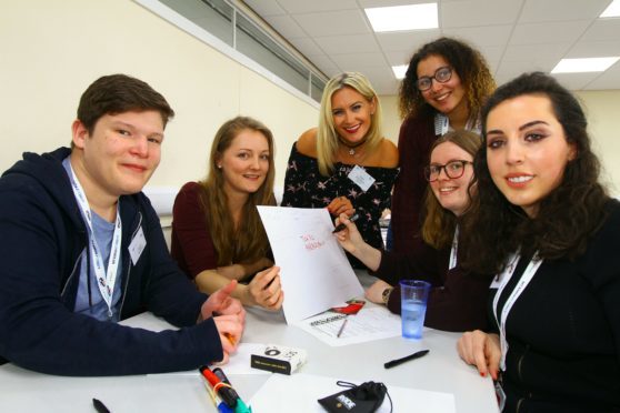 Host Jodie McCallum with a group doing a production workshop with Callum McArthur, Chloe Miller Kelly, Robyn Donoghue, Yasim Mselli and Jorgie Hill.