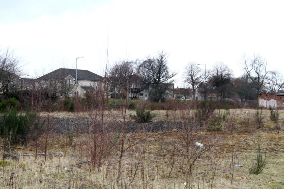 The vacant spot earmarked for housing by a developer, but protected as employment land by the local authority.