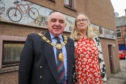 Angus Provost Ronnie Proctor and artist, Maureen Crosbie with the Cumberland Close mosaic