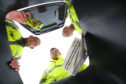 Area supervisor Charlie Paterson, Environmental 
 Services boss Graeme Dailly and driver Paul Cameron at Forfar vwaste depot