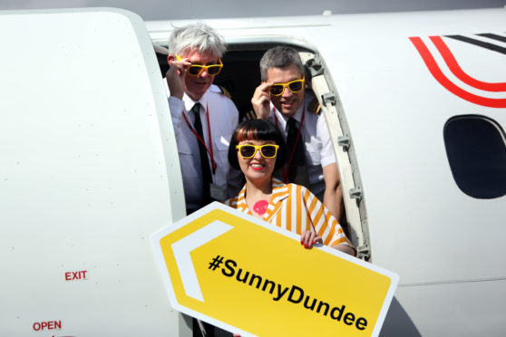 Cpt Mike Cryle, First Officer Peter Nugent and V&A Dundee design champion Kirsty Stevens on the Logan Air flight at Dundee Airport.