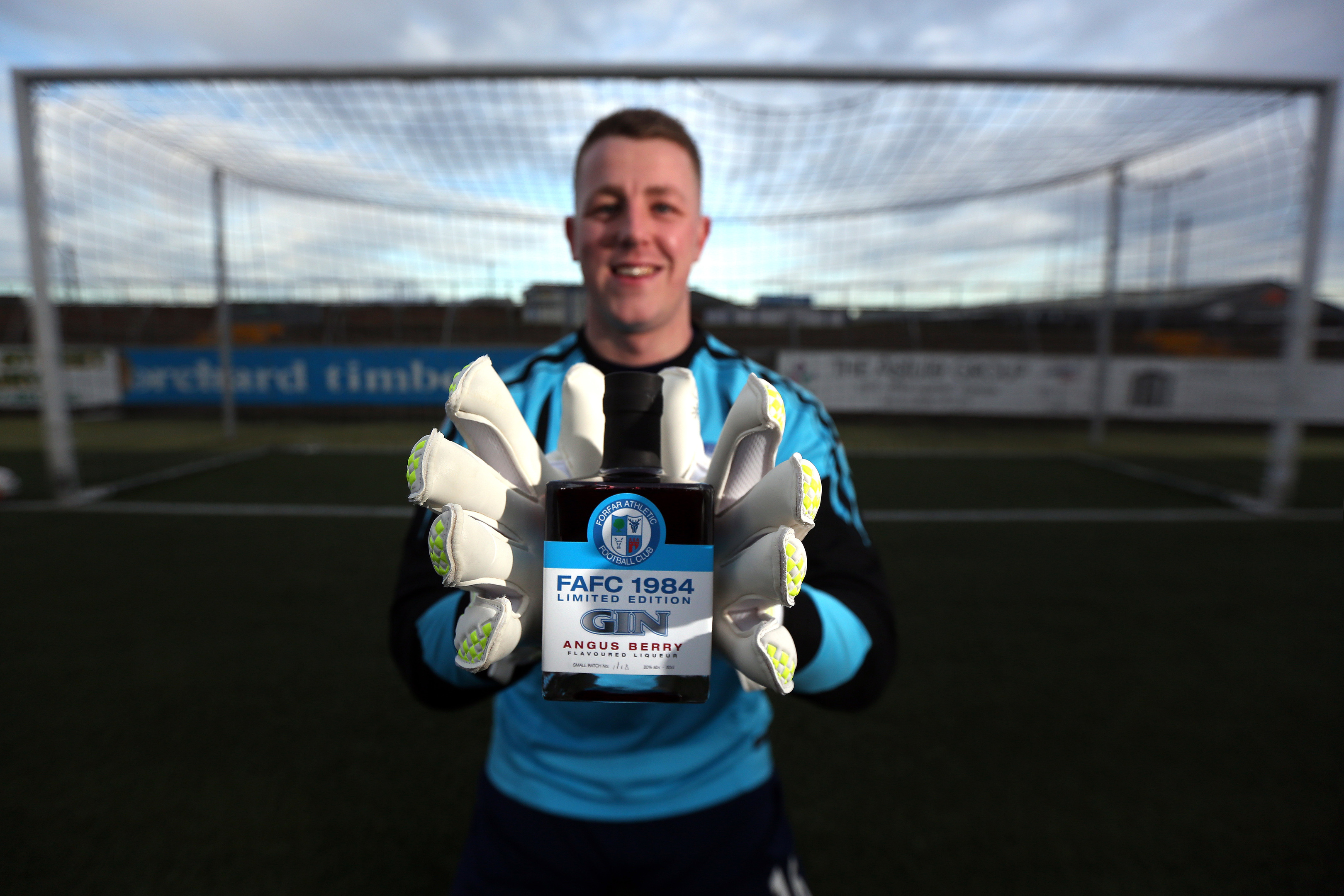 Forfar Athletic 'keeper Marc McCallum gets his hands on a bottle of the FAFC 1984 limited edition gin during a training session at Station Park.