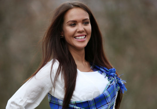 Miss Great Britain finalist Louisa Thomson models a new tartan, dubbed "the world's first mental health tartan," that has been created for the charity Support in Mind Scotland, in Edinburgh.
