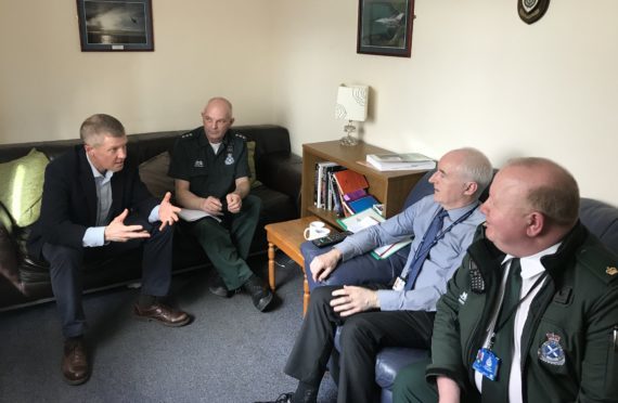 Mr Rennie with representatives of the service  including Derek Louttit, national clinical risk manager, and Lewis Campbell, regional director for the Scottish Ambulance Service east division.