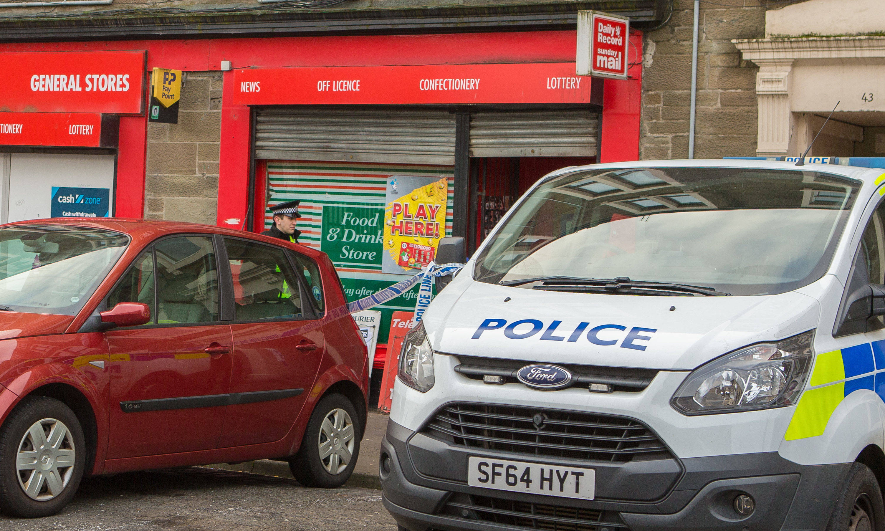 Police at the General Stores in Dundonald Street when it was targeted by a robber in November 2017.