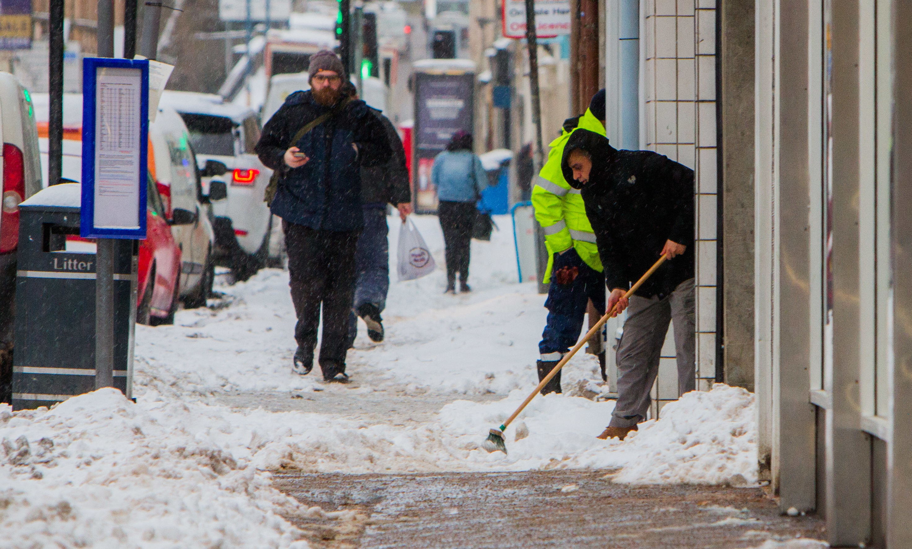 Pavements in South Street, Perth, being cleared of snow during the Beast from the East weather blast.