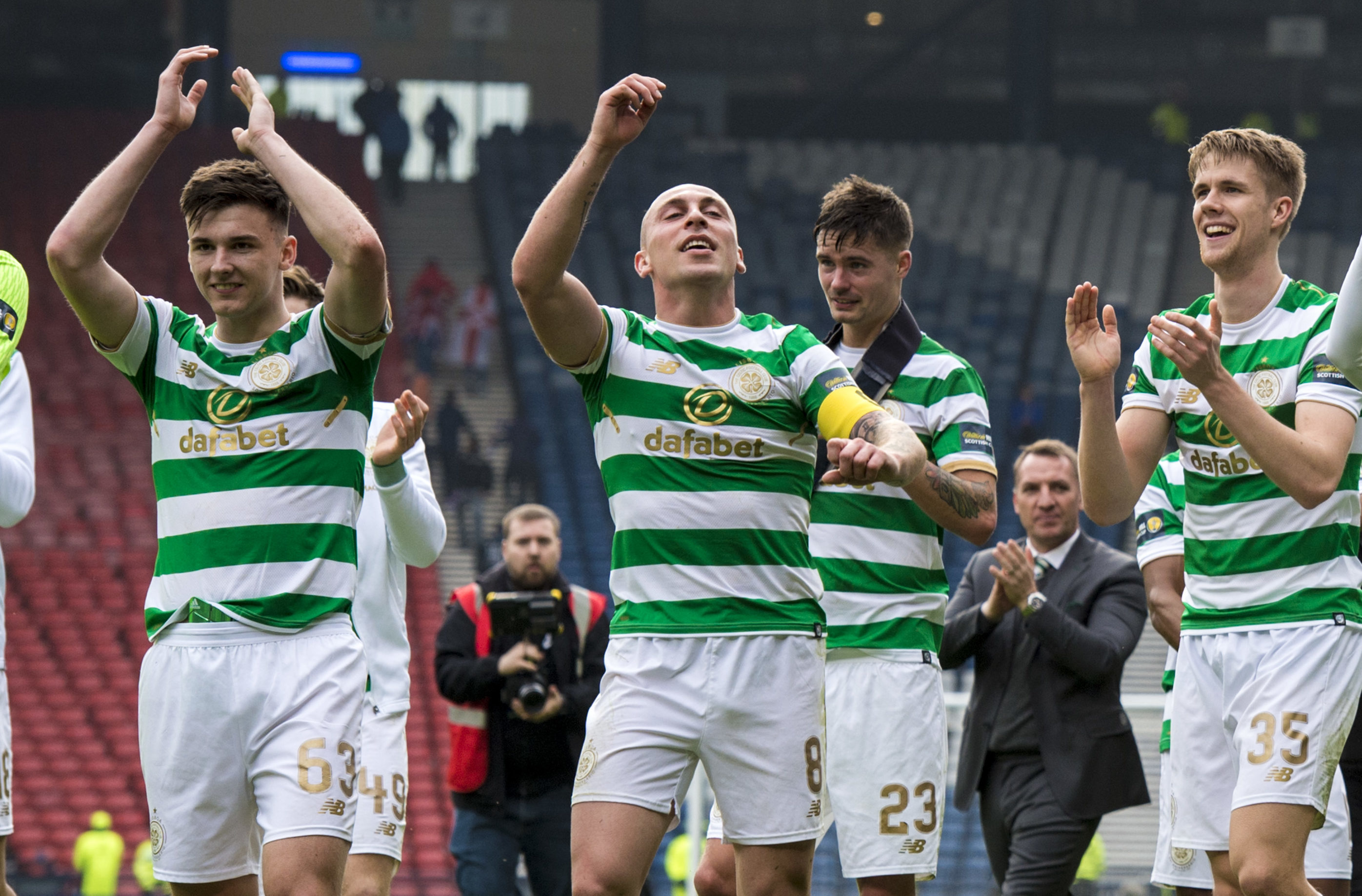 The Celtic players celebrate after cup win.