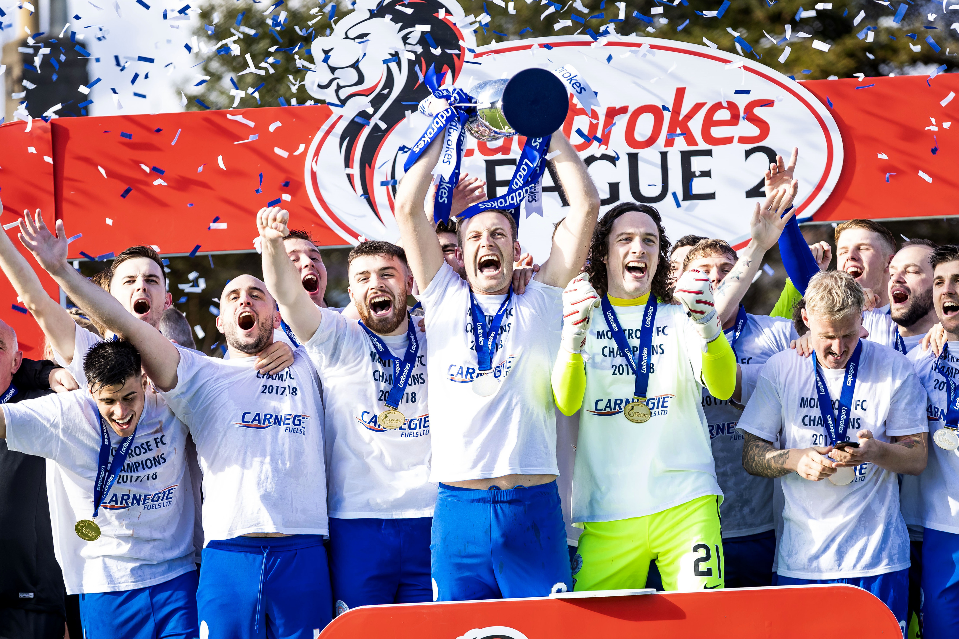 Montrose celebrate winning the Ladbrokes League Two title