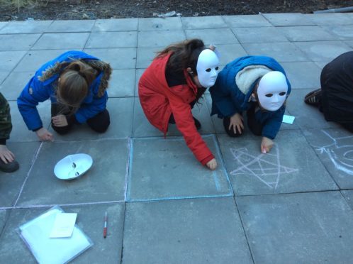 Pupils from St Ninian's getting involved in artwork in Guard Vennel in Perth city centre