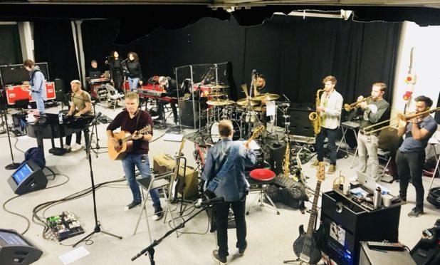 Gary Barlow posted this photo of rehearsals for the tour.