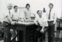Professor Spear (seated second from right) and Professor LeComber (standing, far right) and research group in the 1970s.