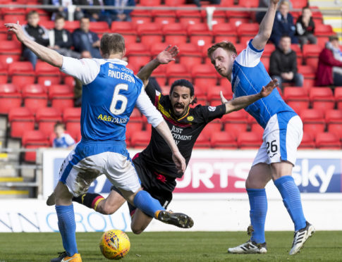 Ryan Edwards goes down for the Thistle penalty.