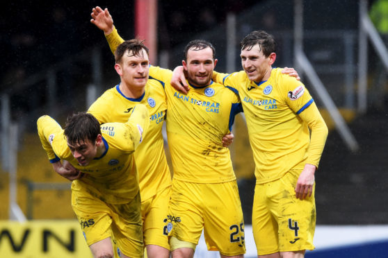 Liam Craig helps Chris Kane celebrate one of his goals at Dens.