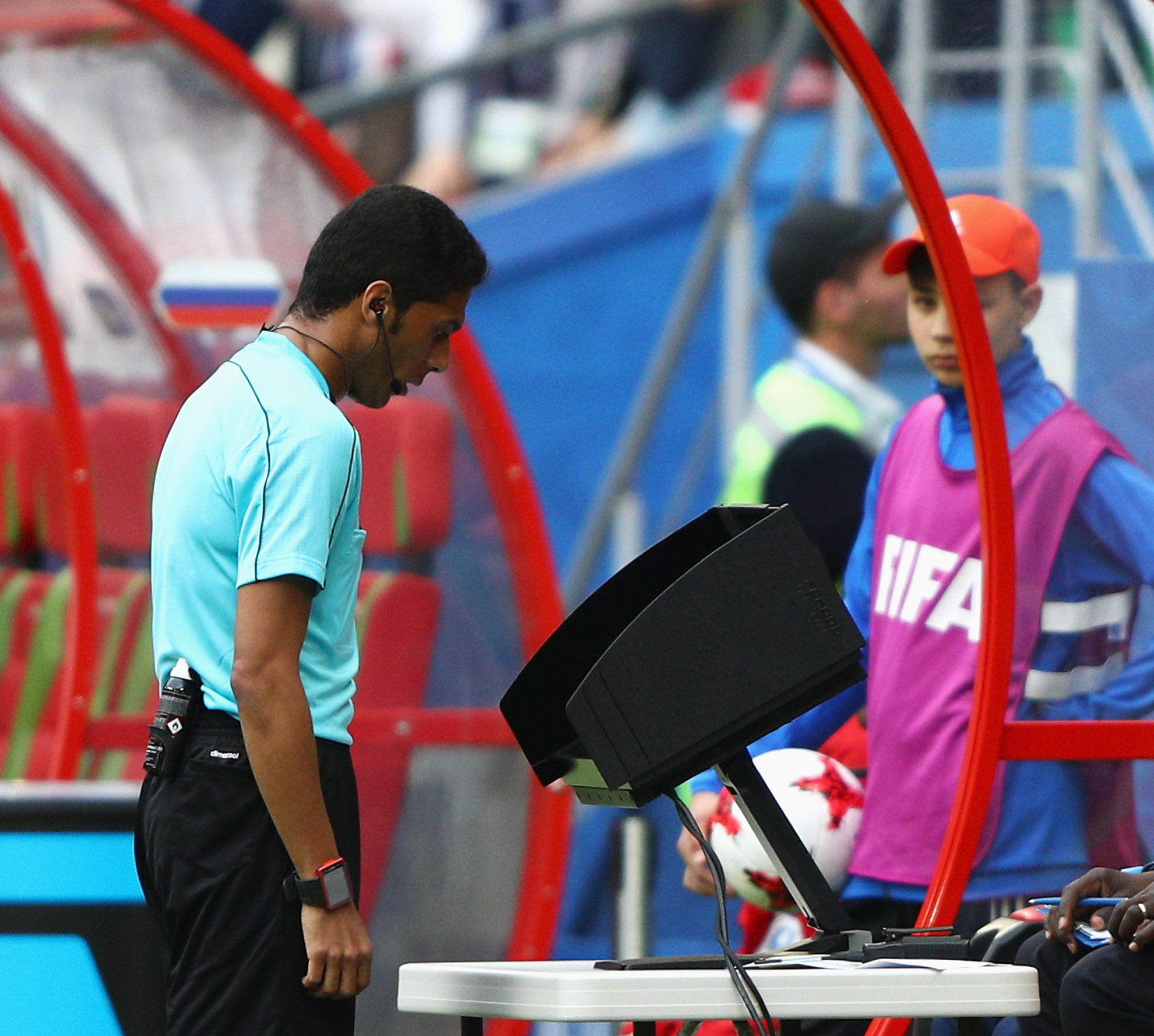 A referee uses the VAR technology.