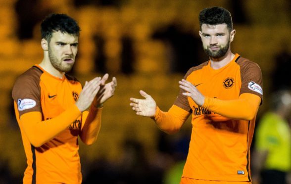 Scott Fraser and Mark Durnan applaud the United fans at full-time at Livingston.