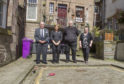 Councillor Colin Brown (left) with Dawn McFarlane of the Osnaburg Bar, Neil MacKay of The Pend Emporium and Jacqui Robb of Auntie Jacquis before they set about cleaning up the street.