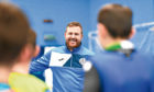Former professional footballer  Russell Taylor of Futsal Escocia  coaching children at Inverkeithing High School in Fife.