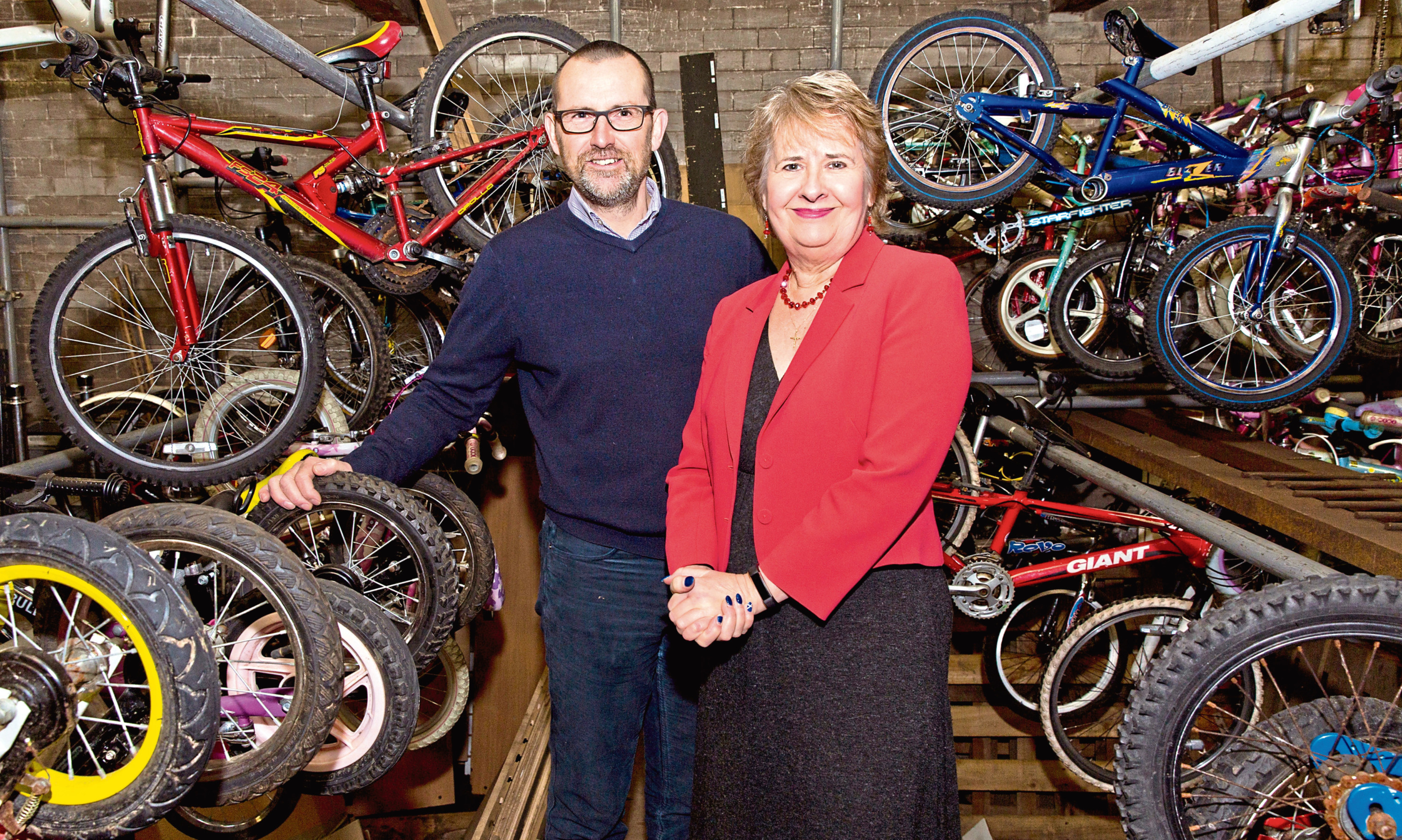 Iain Gulland of Zero Waste Scotland with Scottish Environment Secretary Roseanna Cunningham on a visit to The Bike Station of Perth, an organisation promoting the repair and re-use of bicycles.