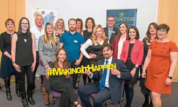 The manager of Perth Accelerator Caryn Gibson and Finlay Kerr, PKC Project Officer, surrounded by the participants on Perth's first Accelerator programme.