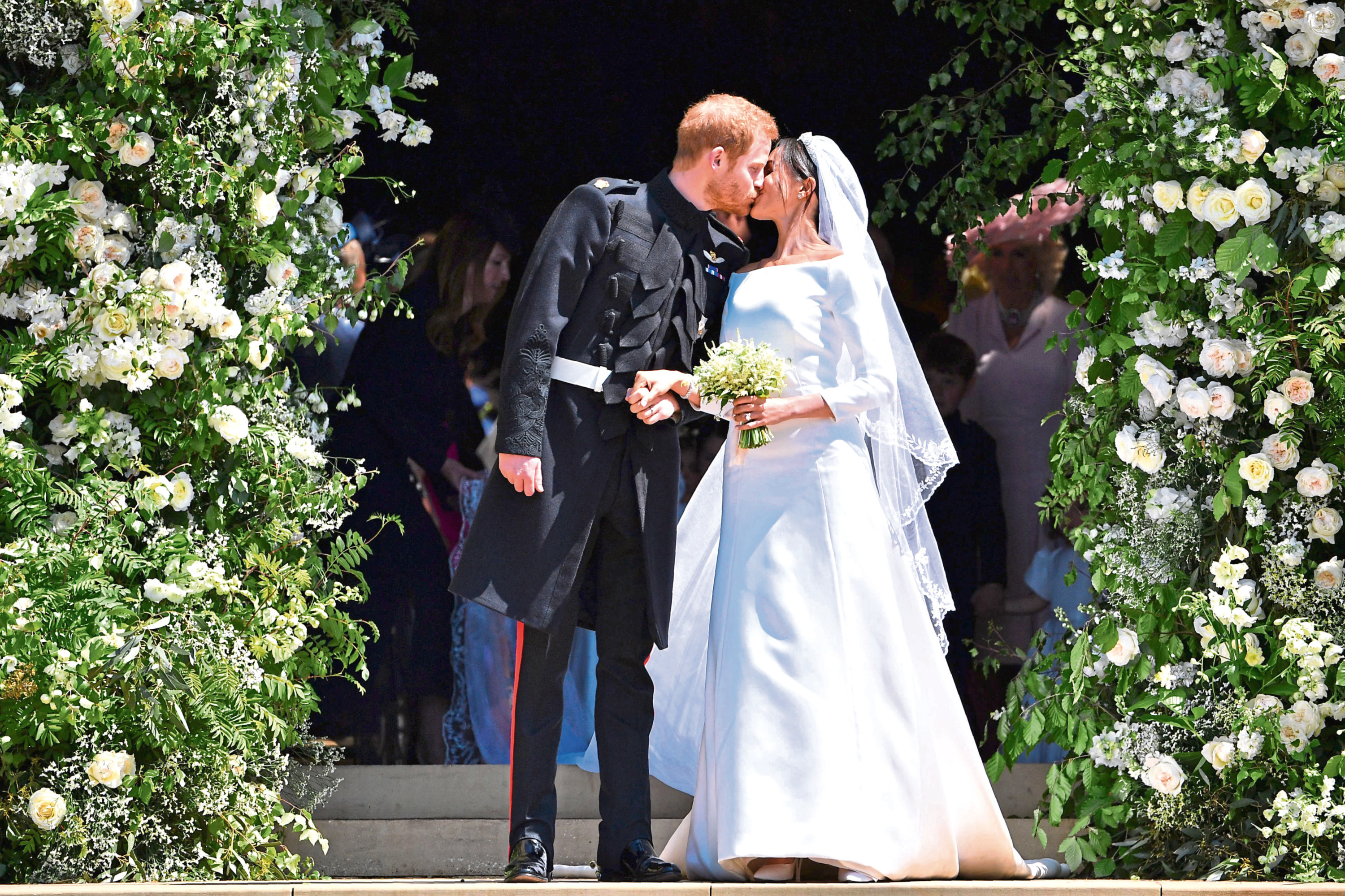 Prince Harry and Meghan Markle kiss as they leave at St. George's Chapel in Windsor Castle after their wedding.