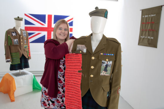 Kiera Marshall with her upcoming exhibit, which features archived Courier clippings