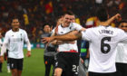 Andy Robertson of Liverpool and teammates celebrate after the full time whistle as Liverpool qualify for the Champions League Final