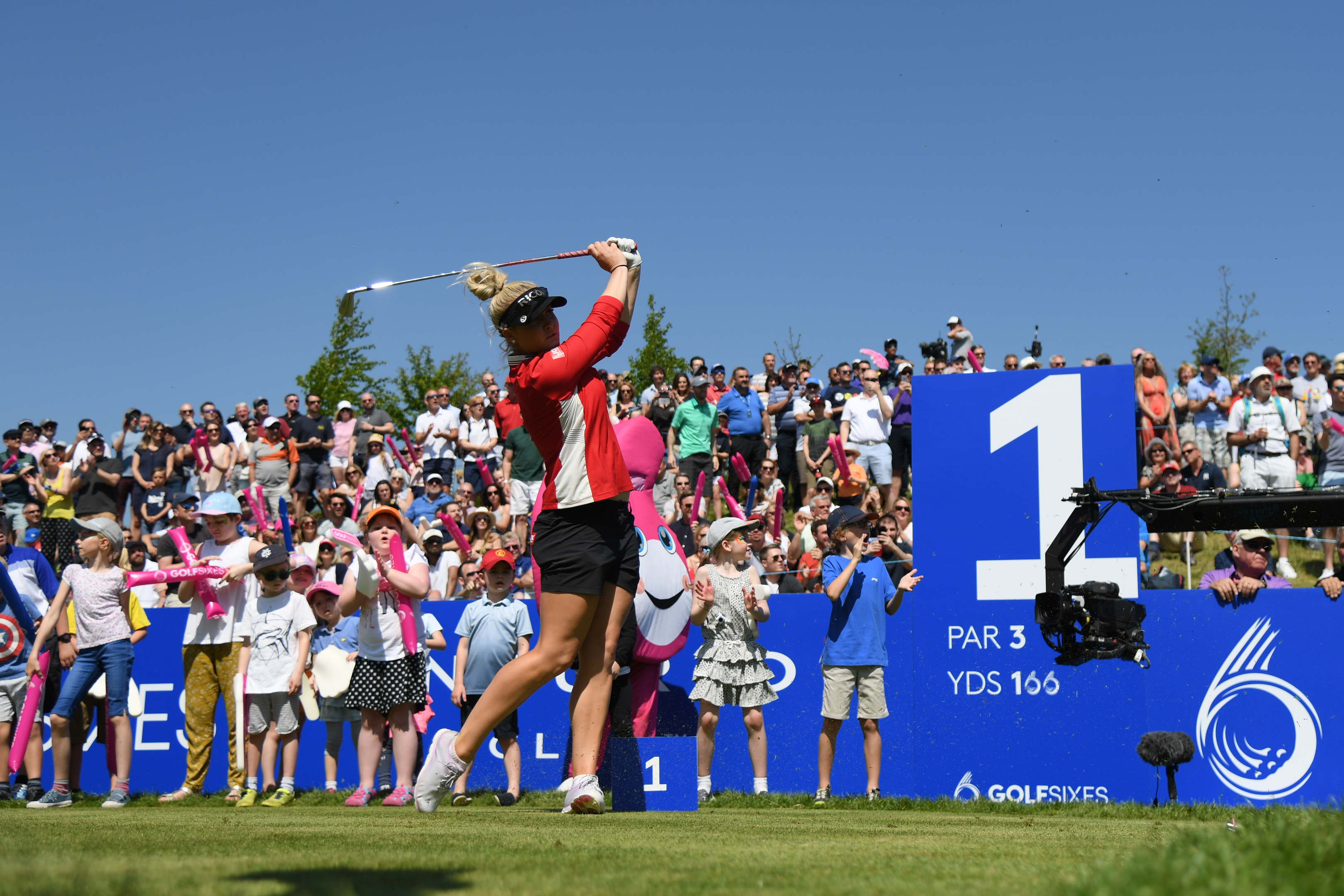 Charley Hull tees off in front of big crowds at the GolfSixes but England's women lost to eventual champions Ireland.