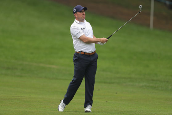 Richie Ramsay hits his second shot on the 4th during the first round of the BMW PGA Championship.