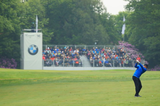 Rory McIlroy stayed in the lead at the BMW PGA Championship at Wentworth, but only just.