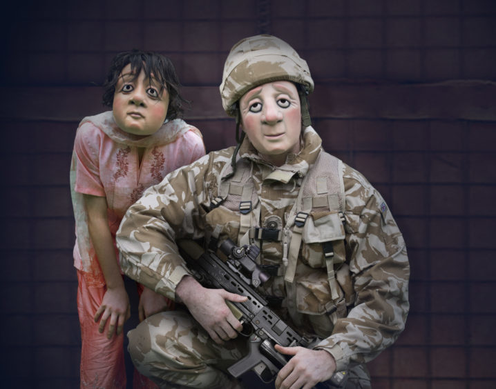 A soldier and child in A Brave Face