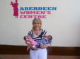 Ann Gloag with twins at the Aberdeen Women's Centre in Sierra Leone.