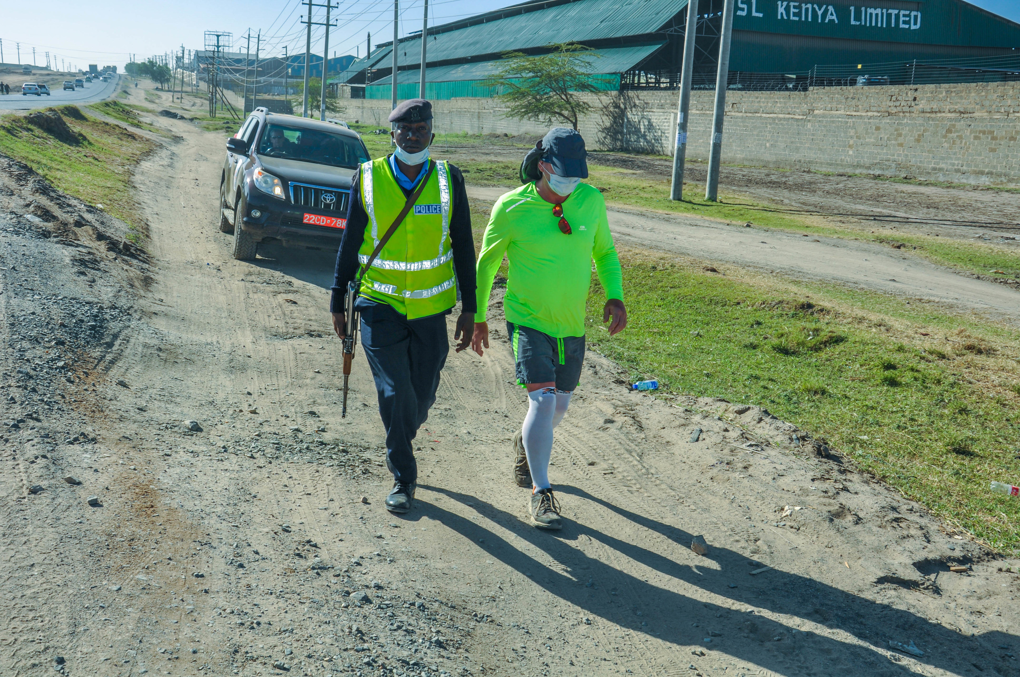Mark walking with an armed guard during the marathon trek