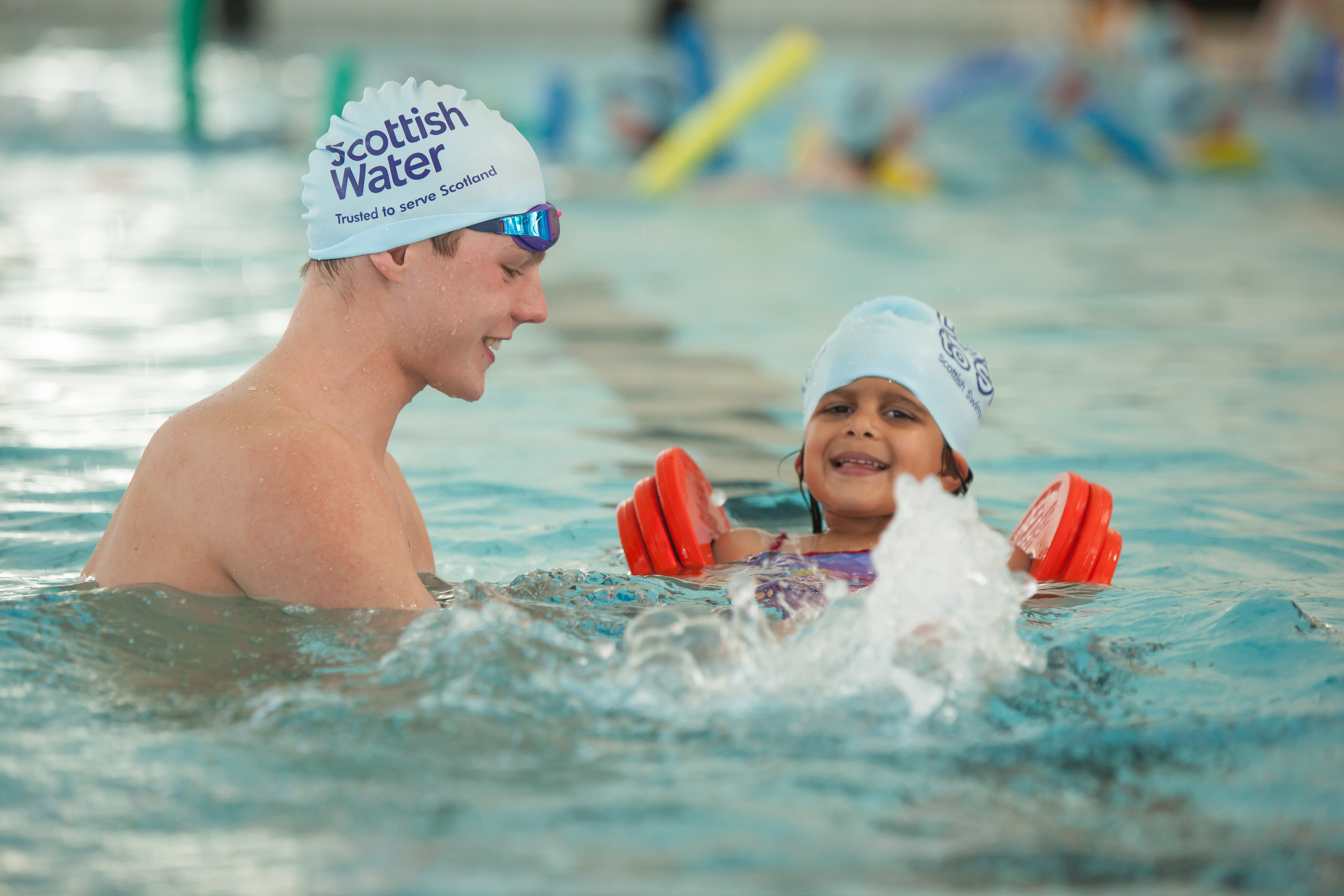 Duncan Scott - Olympic, world, Commonwealth and European swimmer -helps Yasmin Diraham, 4, improve her swimming style during his visit to Michael Woods sport and leisure centre, Glenrothes