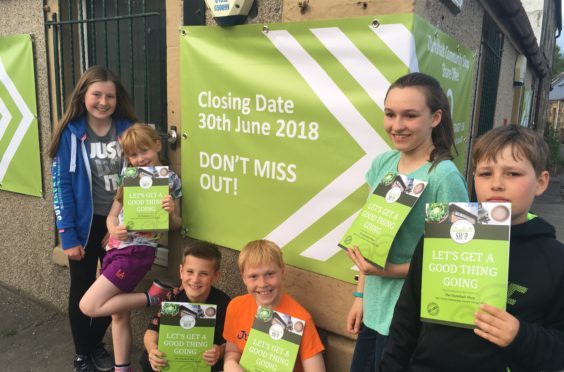 Children in Dunshalt are urging residents to buy shares in their local shop