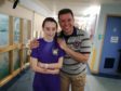 Amber Whamond with Thanos Tsirikos who conducted her surgery at the Royal Hospital for Sick Kids in Edinburgh.
