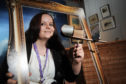 Museum assistant, Lucia Wallbank with the steroscopic viewer